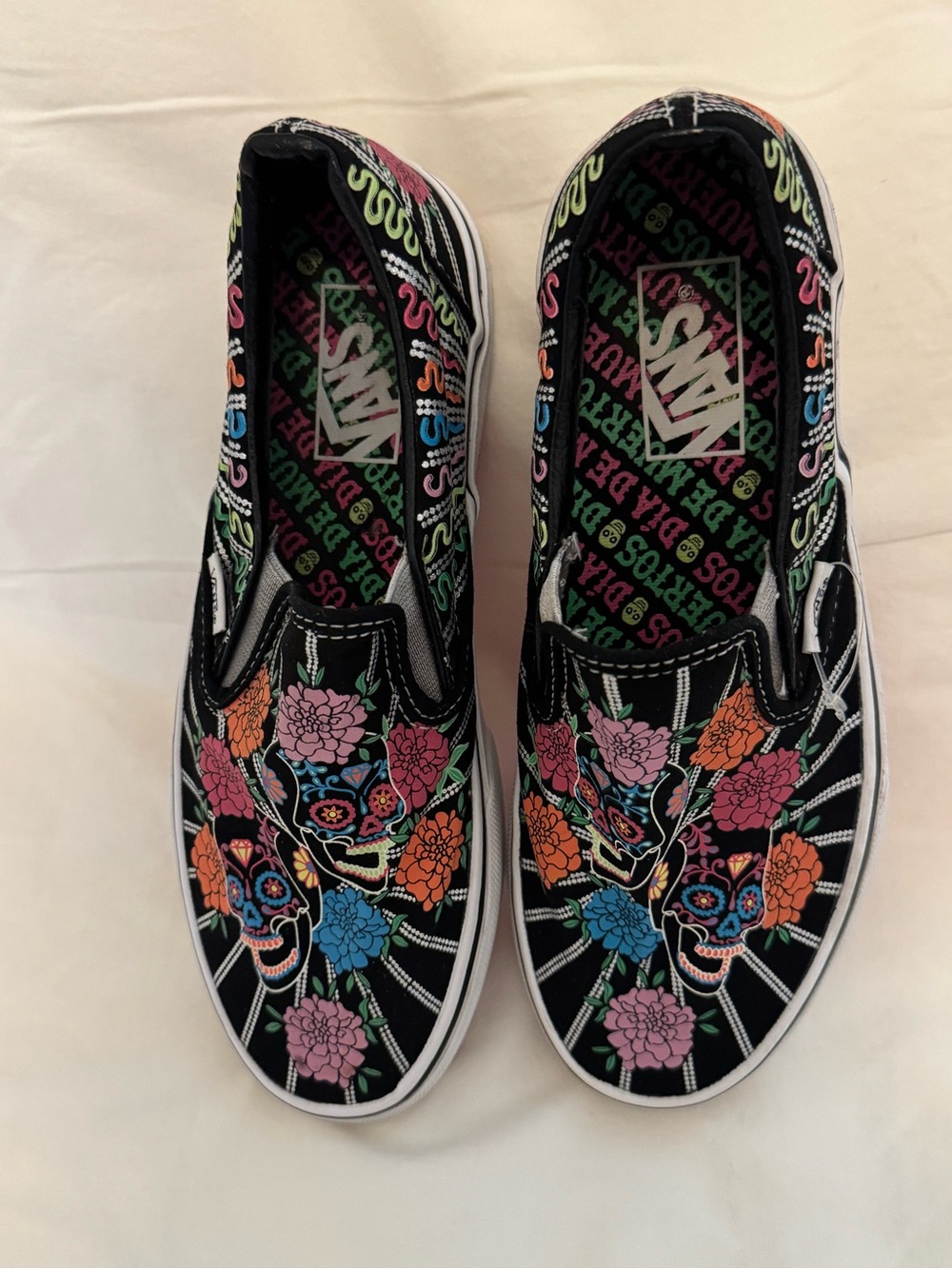Vans Black Slip-On Sneakers with Multicolor Sugar Skull Floral Design